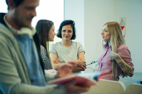 Colleagues chatting in office Stock Photos