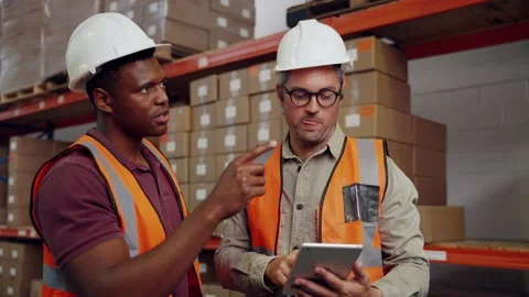 Colleagues checking checklist for delivery process of parcels standing in 스톡 동영상 140493874