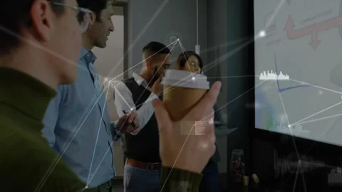 Colleagues clustering around touchscreen stylus tapping graph data overlay Stock Footage 311962851
