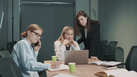 Colleagues collaborate in office setting to solve problems and discuss ideas Video stock 326325070