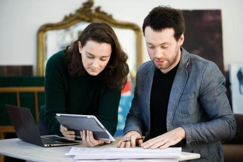 Colleagues collaborate on project Stock Photos