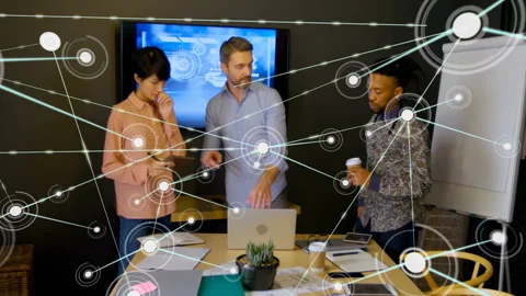 Colleagues collaborating around conference table, with technology network nodes Vídeos de archivo 308658575