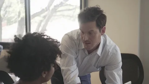 Colleagues collaborating in office Stock Footage 75207232