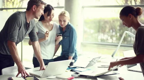 Colleagues collaborating on project Stock Footage 63289720