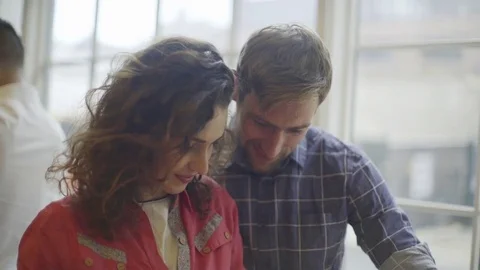 Colleagues collaborating on project Stock Footage 75187424