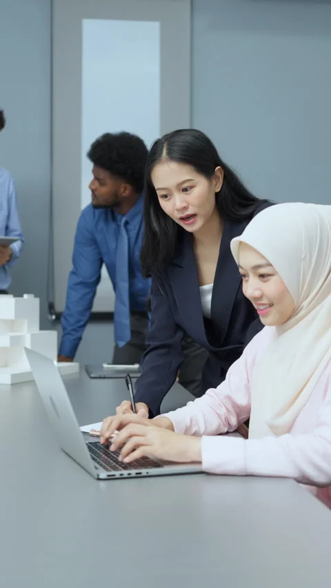 Colleagues Collaborating on Project in Office Workspace Stock Footage 286066415