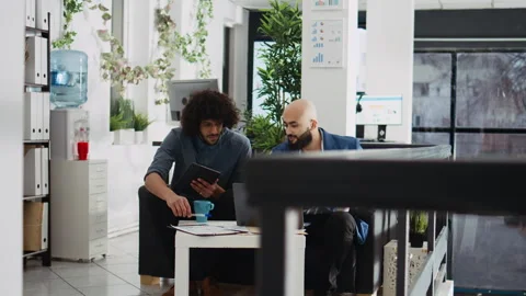 Colleagues comparing data analytics Stock Footage 244646496