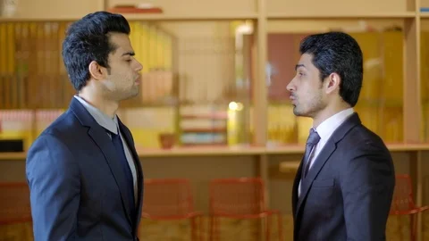 Colleagues confident and sharp in formals meet and discuss and talk casually unt Stock Footage 104895893