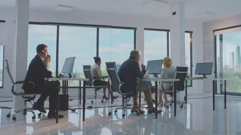 Colleagues cooperating at work Video stock 164532130