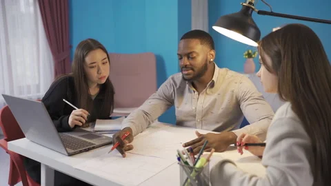 Colleagues of different ethnicities brainstorm on the project. Stock Footage 228804327