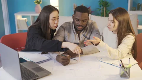 Colleagues of different races working on project at home. Stock Footage 228812708