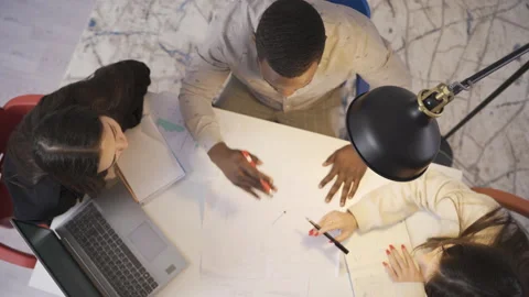 Colleagues of different races working together on the project. Stock Footage 228804133