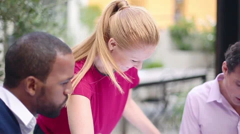 Colleagues discussing blueprints Stock Footage 63305169