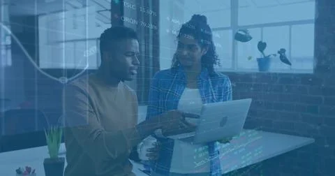 Colleagues discussing code holding laptop and coffee mug in tech office, with Stock Photos