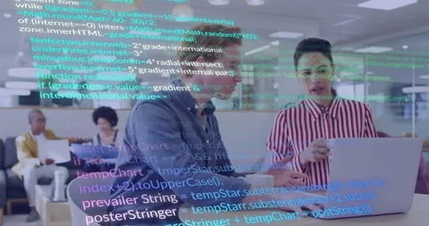 Colleagues discussing code at white table with laptop and mug, showing animated Stock Footage 309068319