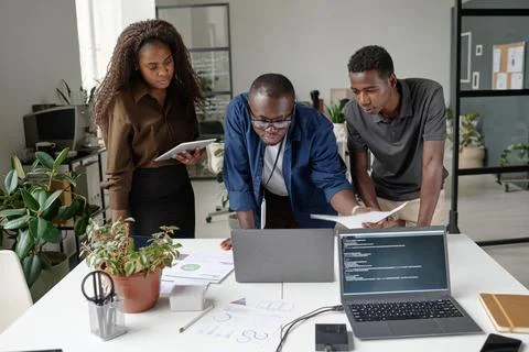 Colleagues Discussing Codes Stock Photos