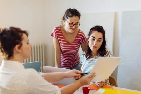 Colleagues discussing documents Stock Photos