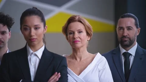 Colleagues, employees, workers in suits with documents looking at camera Video stock 233717084