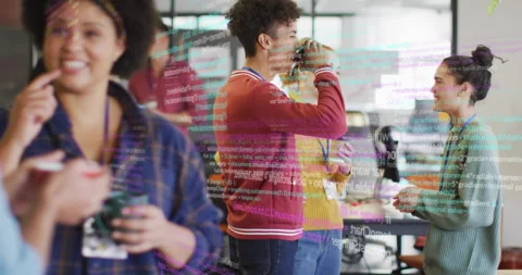 Colleagues exchanging cups and sipping while animated code overlay sparking tech Stock Footage 314348722