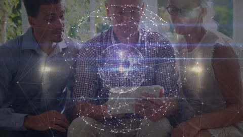 Colleagues exploring data models around tablet in technology lounge, with Stock Footage 327711867