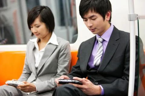 Colleagues game Train Inside the car. Leisure Focus. Asian Sitting Staff Freedom Stock Photos