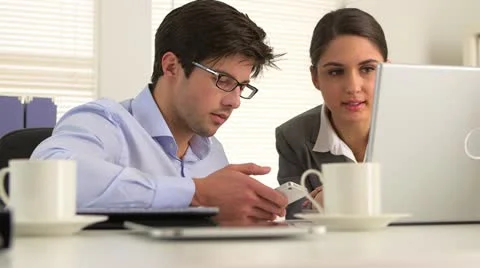 Colleagues hard at work Video stock 21377353