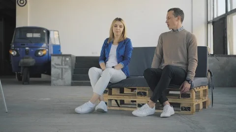Colleagues have fun dancing together. The manager rolls an employee in an office Stock Footage 124657792
