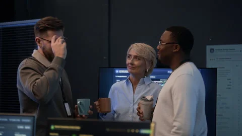 Colleagues Having Coffee Break and Talking in Cybersecurity Office Stock Footage 334935453
