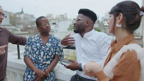 Colleagues Having Conversation during Break Outdoors on Urban Rooftop Stock Footage 256946751