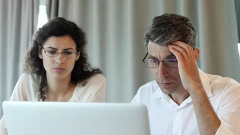 Colleagues look disappointed at the computer Stock Footage 78182528