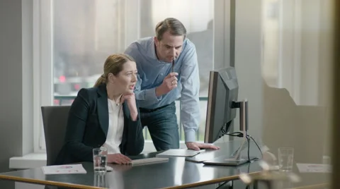 Colleagues looking at screen, analysing data Stock Footage 66914272