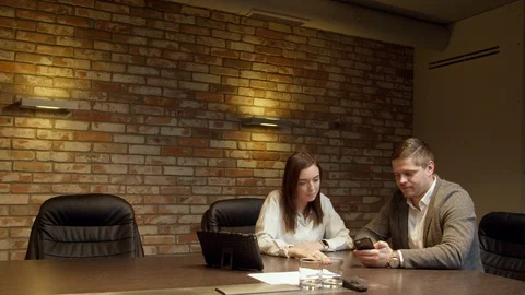 Colleagues looking at smartphone together Stock Footage 127182359