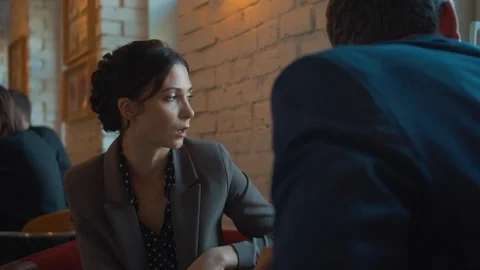 Colleagues at lunch, look out the window and discuss Stock Footage 120640429