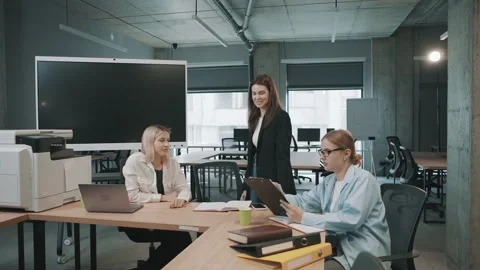 Colleagues meet in office to discuss project details and share ideas Video stock 326326471