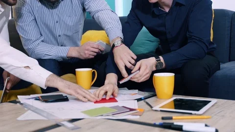 Colleagues men work choose surface texture from the samples in office. Hands Vídeos de archivo 103938209