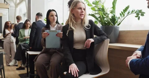 Colleagues in networking discussion at corporate event in bright modern office Stock Footage 337230791