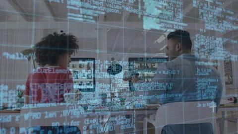 Colleagues noticing code overlay and discussing debugging before bumping fists Stock Footage 314708988