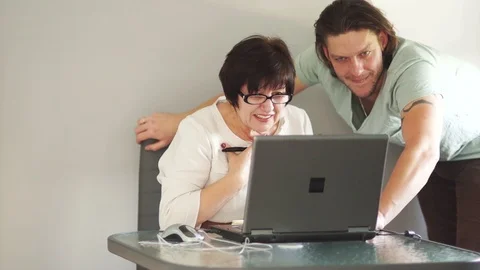 Colleagues in the office are dealing with a new program. Merry laugh. Favorable Stock Footage 86202985