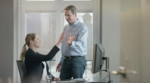 Colleagues at office giving high five Stock Footage 66892816