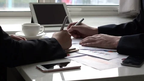 Colleagues Planning Together With Graph In The Office Stock Footage 84841623