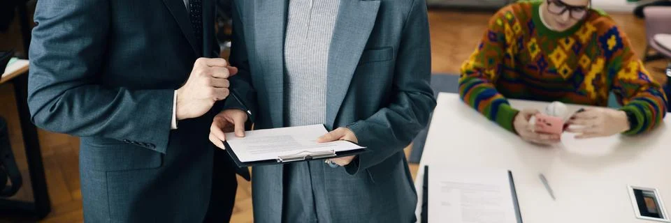 Colleagues Reading Document In Office Stock Photos