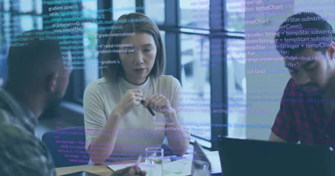 Colleagues reviewing code in conference room as woman asking question spurring Stock Footage 310330840
