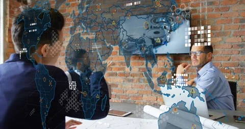 Colleagues reviewing engineering plans while map overlay fading in and pointing Stock Footage 317128292