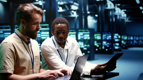 Colleagues running data center tests Stock Footage 248096715