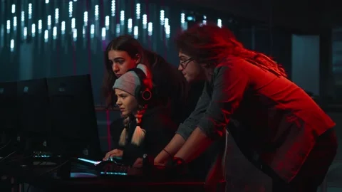 Colleagues from the same team support a girl who loses by playing a game Stock Footage 188334102