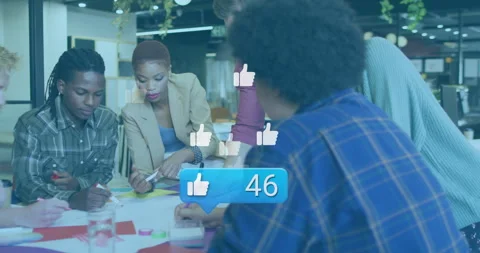 Colleagues scribbling ideas around table, receiving social media likes boosting Stock Footage 315795049