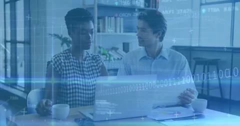 Colleagues scrolling on laptop, causing data overlays and presenting charts for Stock Footage 318115672