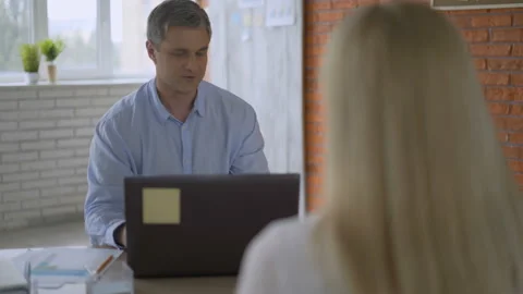 Colleagues share ideas thoughts working together, rear view female boss listens Stock Footage 112832640