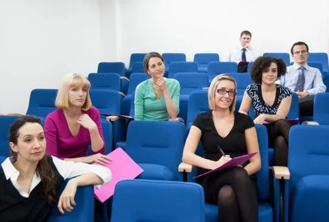 Colleagues sitting for presentation Stock Photos