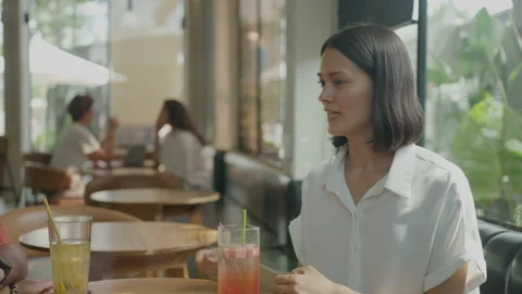 Colleagues Speaking over Drinks at the Cafe Stock-Footage 235770480